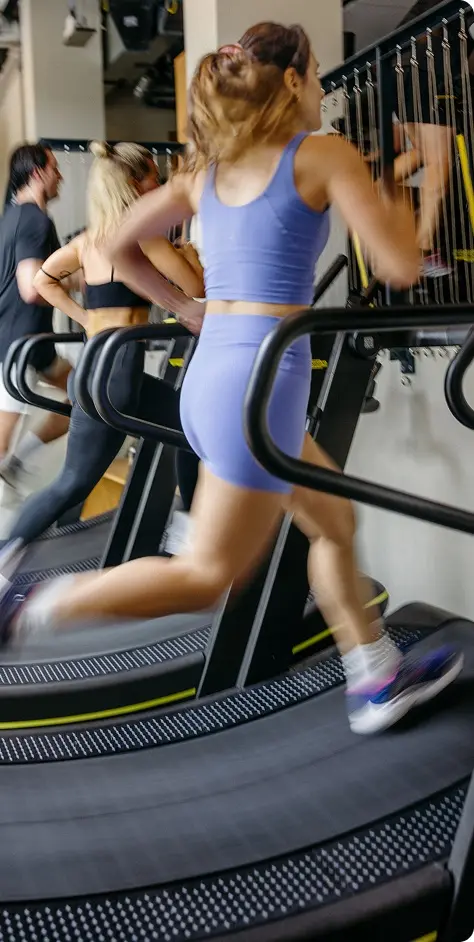 Women running on treadmill in HYROX Gym Miami